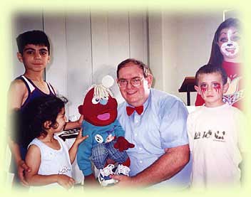 Graham with kids and puppet